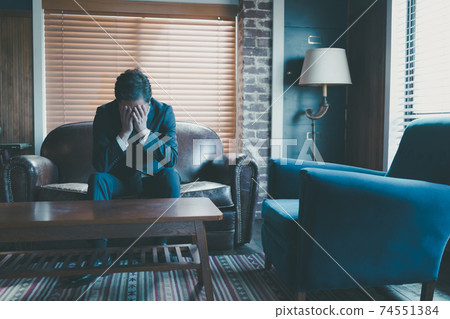 Middle businessman covering the face 74551384