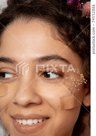 Multiracial girl sharing wide smile to the camera 74552888