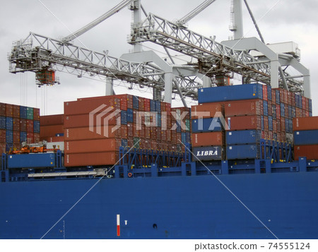 Large container cargo ship at the port in Rotterdam 74555124