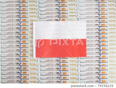 Poland flag on a background from dollar banknotes. Concept of the relationship of the Polish money in relation to the dollar, the country's economy, financial Poland flag on a background from dollar banknotes. Concept of the relationship of the Polish money in relation to the dollar, the country's economy, financial 74556229