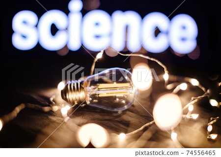 science light filament idea background 74556465