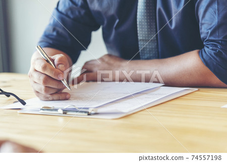 Success collaboration partners sign contract and shake hands after success business joint venture 74557198