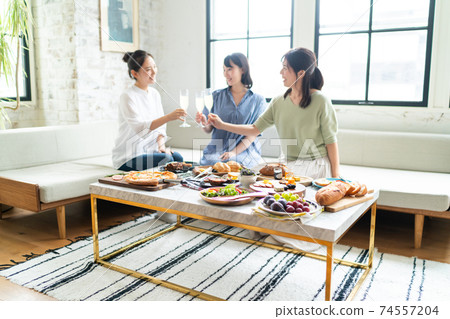 A woman enjoying a meal 74557204