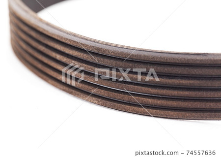 generator rivulet belt, isolate. Car part, close-up generator rivulet belt, isolate. Car part, close-up 74557636