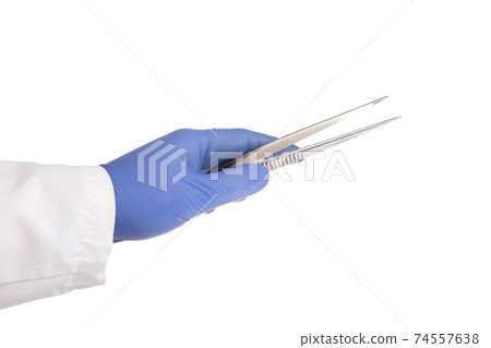 Doctor's hand in a medical glove holds a medical instrument tweezers for an operation on a white background, isolate. Doctor's hand in a medical glove holds a medical instrument tweezers for an operation on a white background, isolate. 74557638