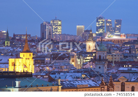 Prague - spires of the old town and office high-rises at dusk 74558554