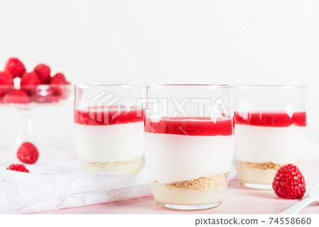 Raspberry dessert from whipped white chocolate mousse and raspbe 74558660