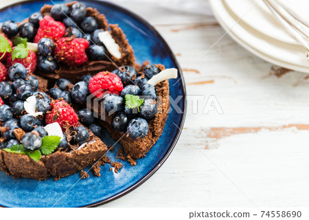 Homemade Chocolate Tart with Blueberries and Raspberries 74558690