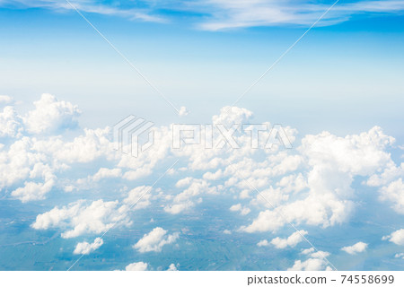 Skyline View above the Clouds from Airplane Skyline View above the Clouds from Airplane 74558699