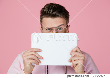 Caucasian man's portrait isolated on pink studio background with copyspace 74559248