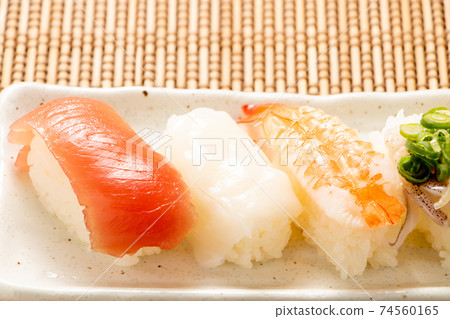 Assorted nigiri sushi. 74560165