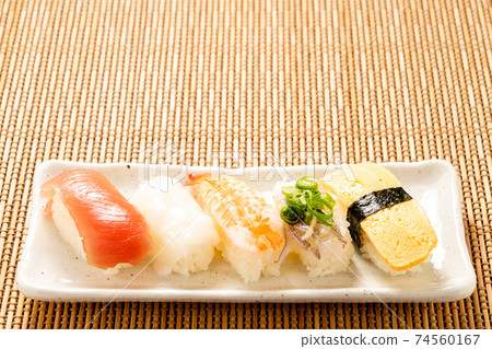 Assorted nigiri sushi. 74560167