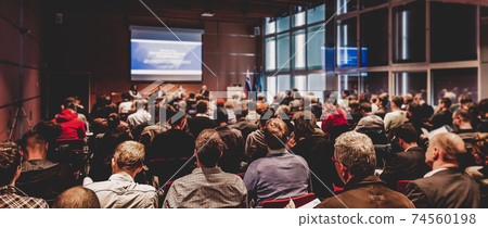Speaker giving presentation on business conference meeting. 74560198