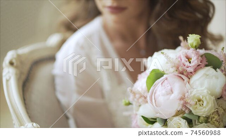 Bride with bouquet of the bride. Beautiful bouquet of the bride. Bride and groom hug each other. Bride with bouquet of the bride. Beautiful bouquet of the bride. Bride and groom hug each other. 74560988
