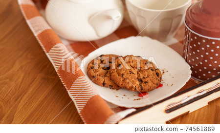 Homemade oatmeal cookies on a wooden tray. The concept of breakfast 74561889