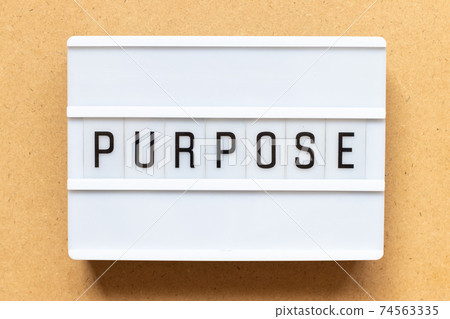 Lightbox with word purpose on wood background 74563335