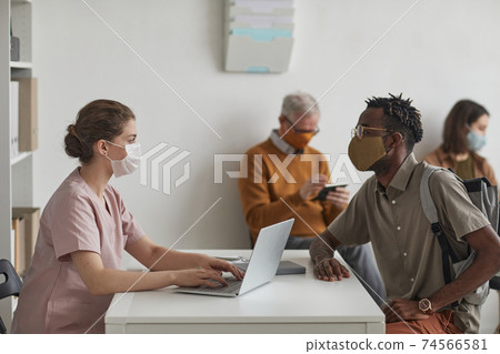 Female Doctor Consulting Patients Female Doctor Consulting Patients 74566581