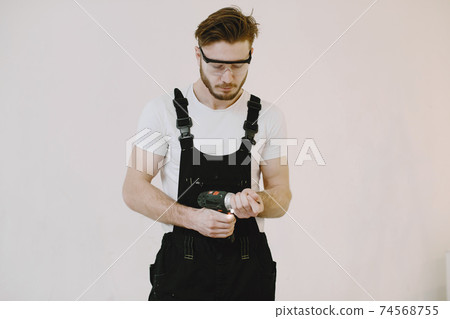 Plumber in uniform on white background Plumber in uniform on white background 74568755