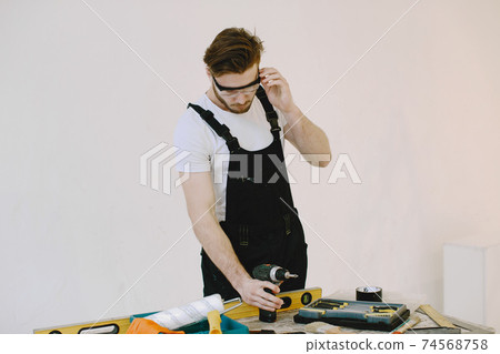 Plumber in uniform on white background Plumber in uniform on white background 74568758