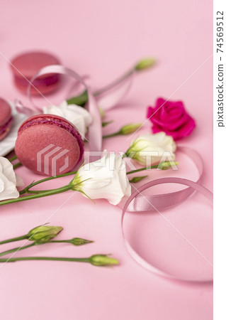 international women's day concept created from white and pink roses, ribbon and pearls on a blank clear pink background international women's day concept created from white and pink roses, ribbon and pearls on a blank clear pink background 74569512