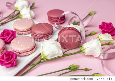 international women's day concept created from white and pink roses, ribbon and pearls on a blank clear pink background international women's day concept created from white and pink roses, ribbon and pearls on a blank clear pink background 74569513