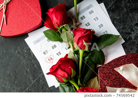 Valentine day. Red hearths and roses on Calendar page. February 14 of Saint Valentines day. Pink background. Valentine day. Red hearths and roses on Calendar page. February 14 of Saint Valentines day. Pink background. 74569542
