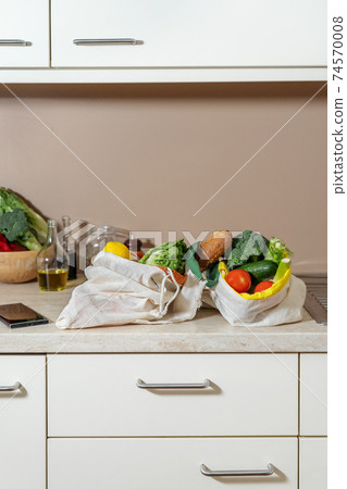 Eco friendly reusable cotton bags with fruits, vegetables and bread 74570008