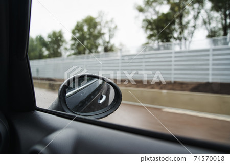 Scenery seen from inside the car while driving on a rainy day Scenery seen from inside the car while driving on a rainy day 74570018