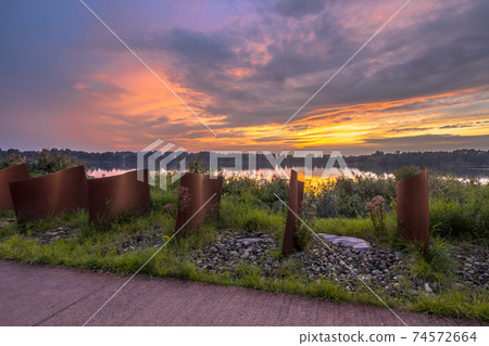 Metal objects in landscape 74572664