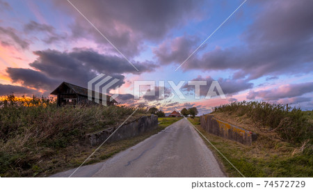 Road passage through dike Road passage through dike 74572729