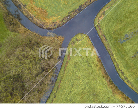 Intersection of rivers in winter 74573160