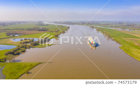 Cargo barge River Lek aerial view Cargo barge River Lek aerial view 74573179