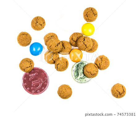 Bunch of pepernoten cookies, sweets and chocolate money 74573381