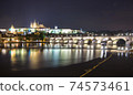 Pargue charles bridge and prague castle by night reflections river 74573461