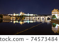 Pargue charles bridge and prague castle by night reflections river 74573484