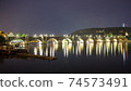 Pargue charles bridge and prague castle by night reflections river 74573491