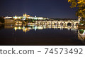 Pargue charles bridge and prague castle by night reflections river 74573492