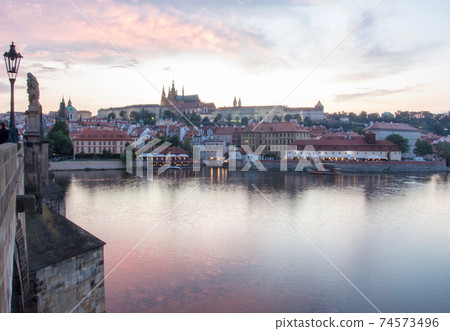 Prague charles bridge sunset view with castle in backgorund Prague charles bridge sunset view with castle in backgorund 74573496