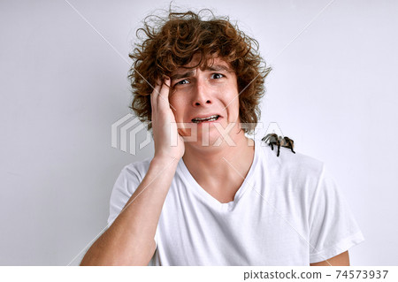 arachnophobia. the fear of spiders and other arachnids, guy with spider on shoulders 74573937