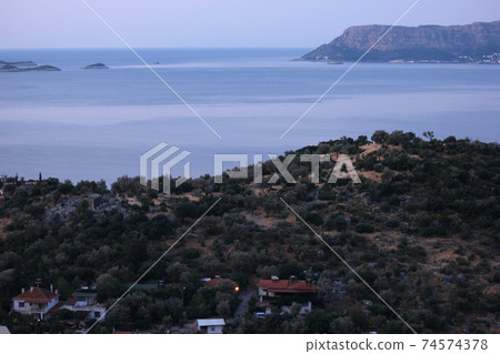Panoramic landscape view with blue lagoon and mountains. Panoramic landscape view with blue lagoon and mountains. 74574378