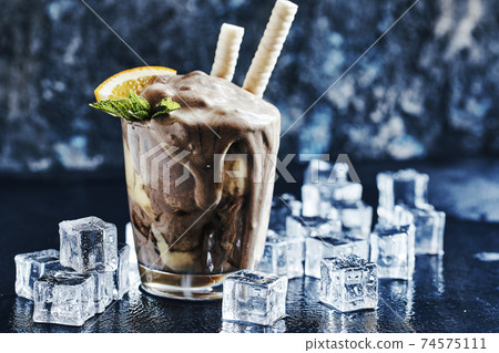 Orange Soda Creamsicle Ice Cream Float with a Straw 74575111