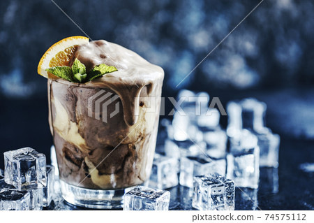 Orange Soda Creamsicle Ice Cream Float with a Straw 74575112