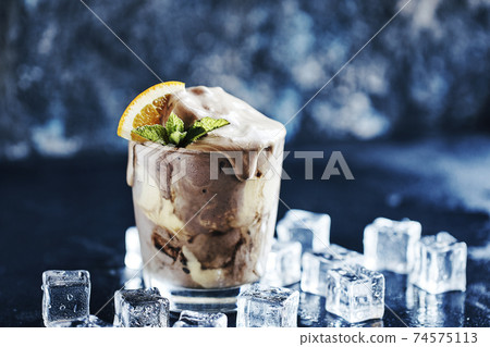 Orange Soda Creamsicle Ice Cream Float with a Straw 74575113