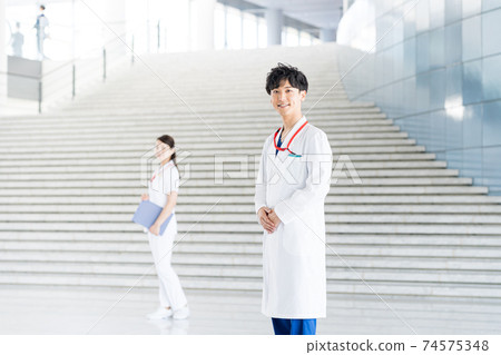 Young doctor working in a hospital 74575348