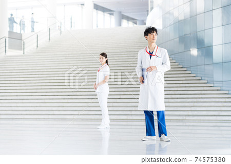 Young doctor working in a hospital 74575380