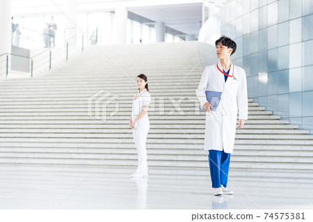 Young doctor working in a hospital Young doctor working in a hospital 74575381