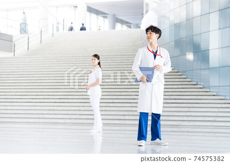 Young doctor working in a hospital Young doctor working in a hospital 74575382