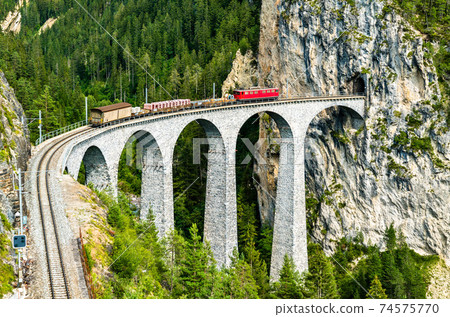 Freight train at the Landwasser Viaduct in Switzerland 74575770