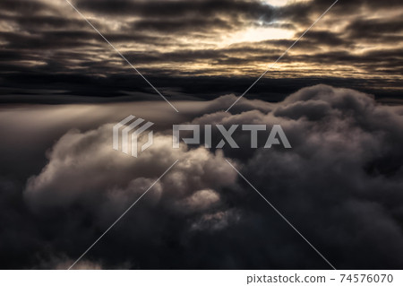 Beautiful and striking aerial view of the puffy clouds Beautiful and striking aerial view of the puffy clouds 74576070