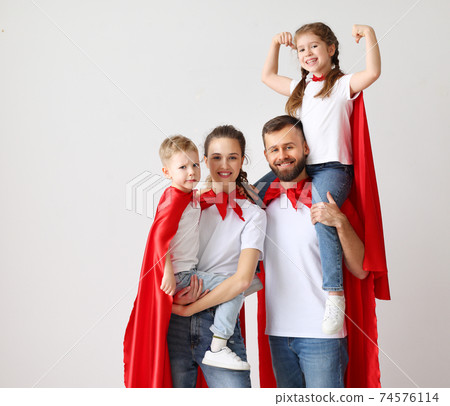 Happy family in Superhero capes 74576114